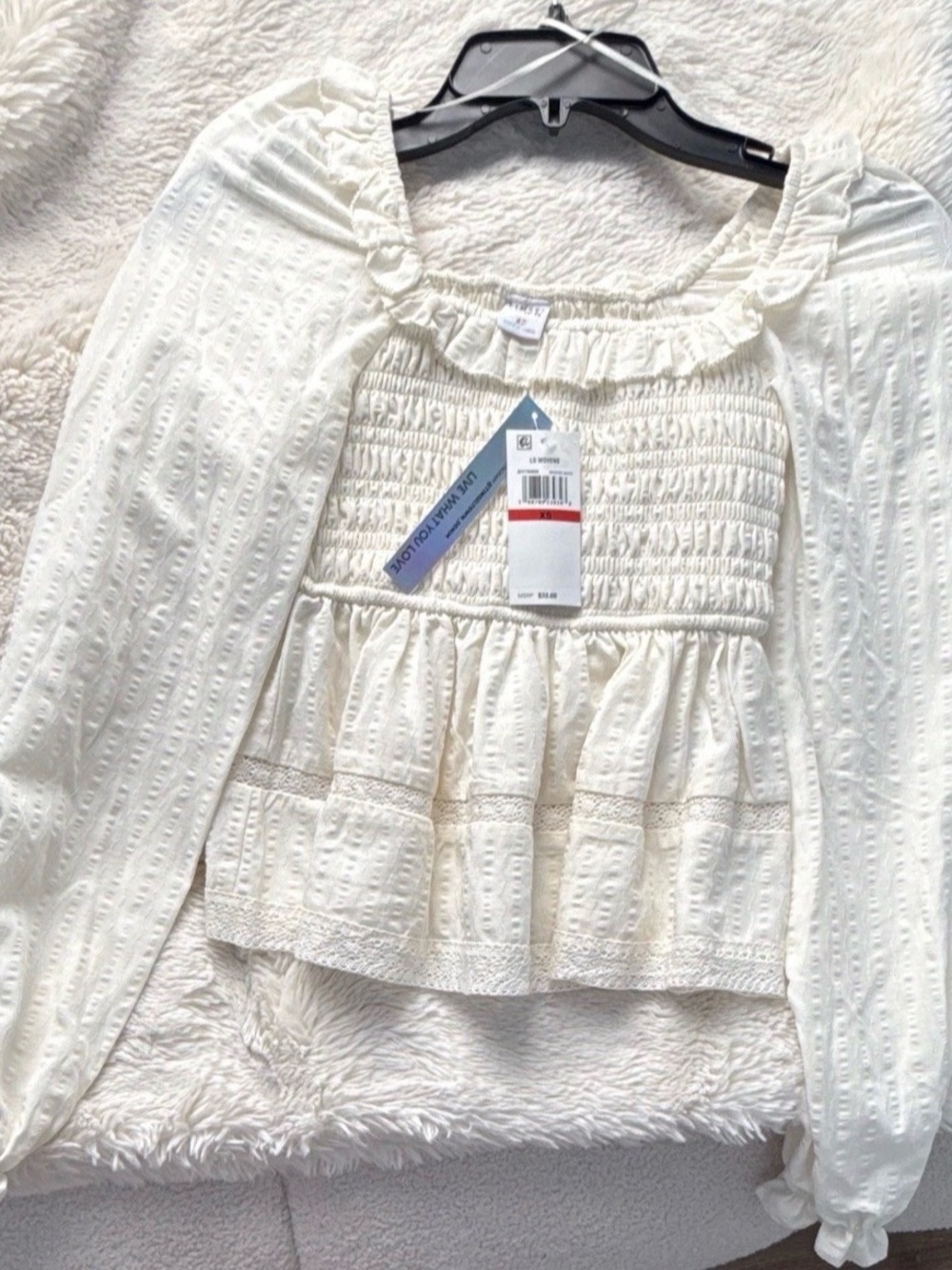 Smocked Ruffle Peplum Blouse in Cream